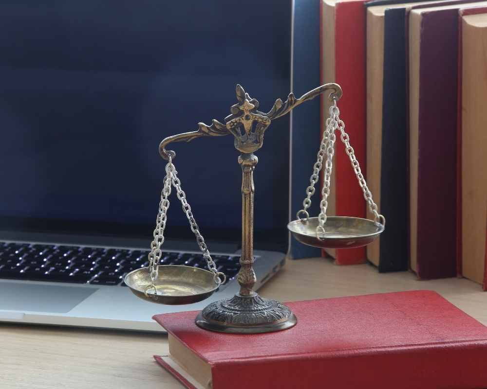 law scales book and computer